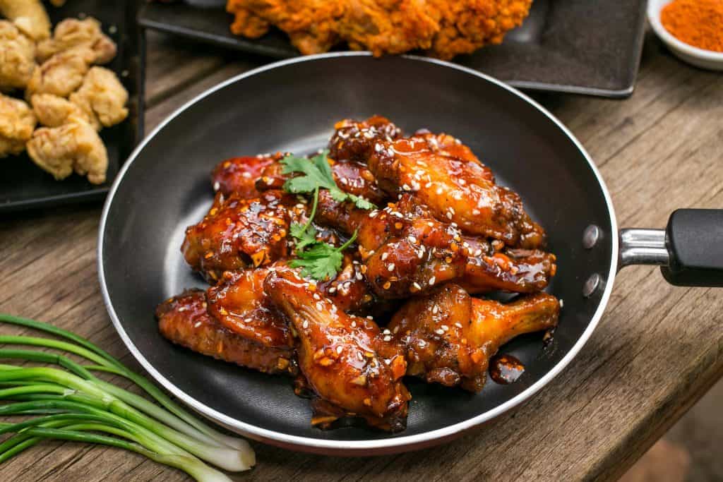 Easy Asian-style crockpot chicken wings with sesame seeds and herbs